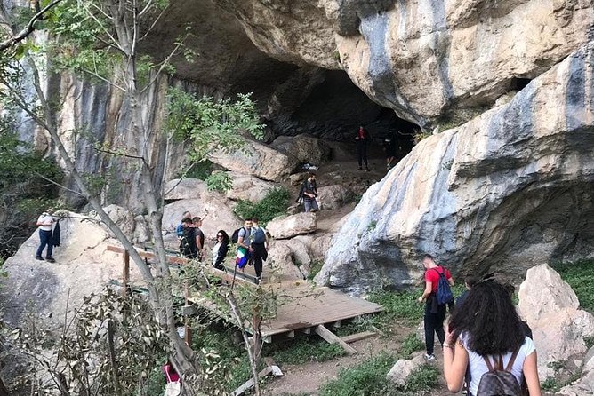 From Tirana: Hiking to Pellumbas cave and Petrela Castle - Inside the Black Cave: torches, helmet, and six karst galleries