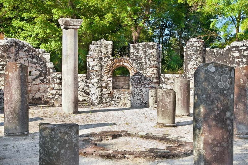 From Tirana: Tour to Butrint, Saranda & Gjirokastër - Entering Butrint National Park, walking a UNESCO site with 2,000+ years behind it