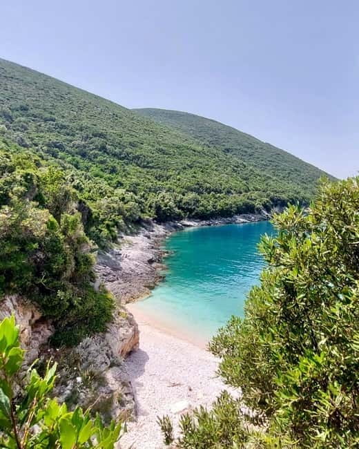 From Vlore: Haxhi Ali Cave & Karaburun Beach Speedboat Tour - St. Koli Bay (Gjiri i Shen Kolit): a 10-minute walk to two small wild beaches