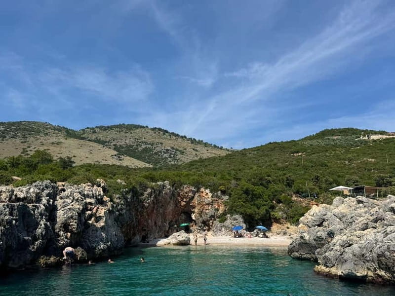 Himara: Hidden Beaches and Caves Small Group Boat Tour - First swim stop, then Secret Cave time on the clock
