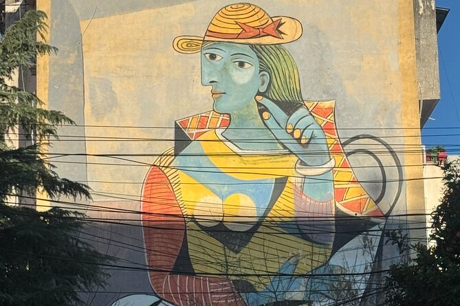 Tirana Mural Bike Tour: Street Art, Culture & Photography Stops - Stop 2: Reja The Cloud, modern architecture you can frame fast