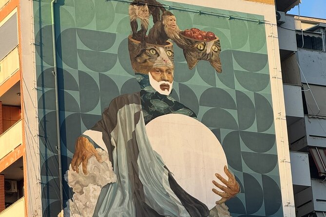Tirana Mural Bike Tour: Street Art, Culture & Photography Stops - Stop 3: Lokomotiva, murals plus industrial textures, plus a tank