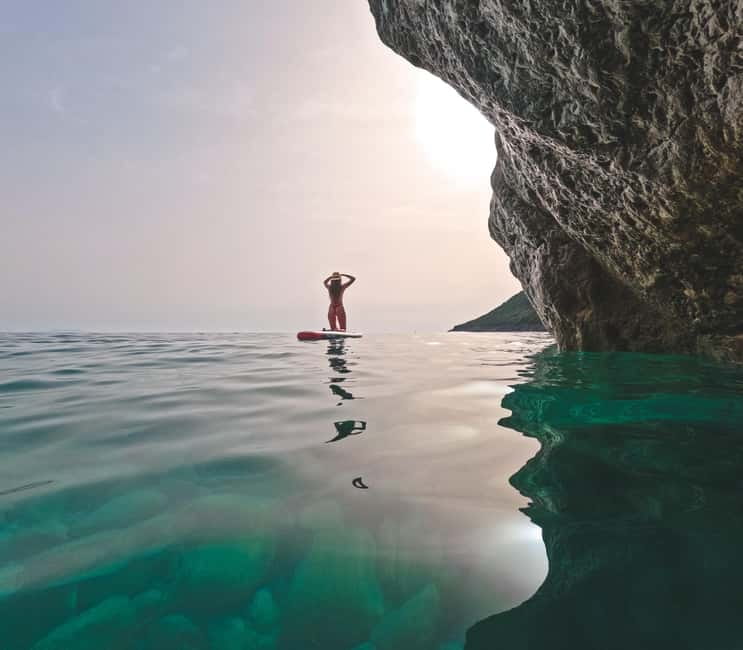 Vlora: Blue Cave and Grama Bay Full-Day Speedboat Tour - Grama Bay Finale: White Sand, Turquoise Water, and Cliff Inscriptions