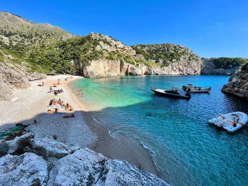 Vlore: Grama Bay & Karaburun Caves 8-Hour Speedboat Tour - Gjiri i Llovizit and the Blue cave: white sand, pebbles, and cave colors